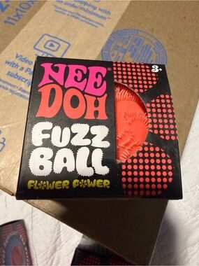 Authentic new NeeDoh Fuzz Ball Flower Power Orange Soft Squeeze Toy
